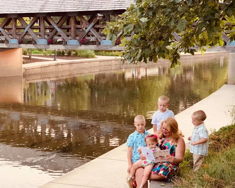 Stefanie Potts reading with children